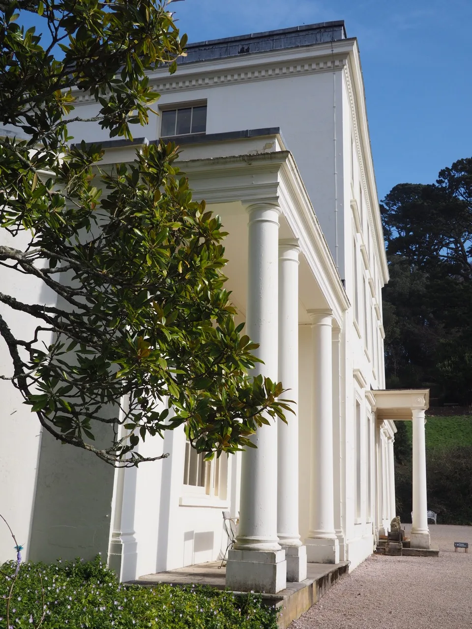 White façade of Greenway House in Devon