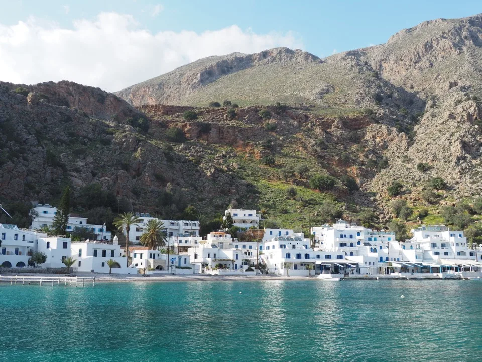 View of the white village of Loutro beneath the mountains