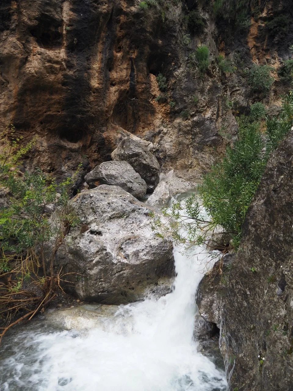 Fast-flowing water in a rocky Cretan gorge