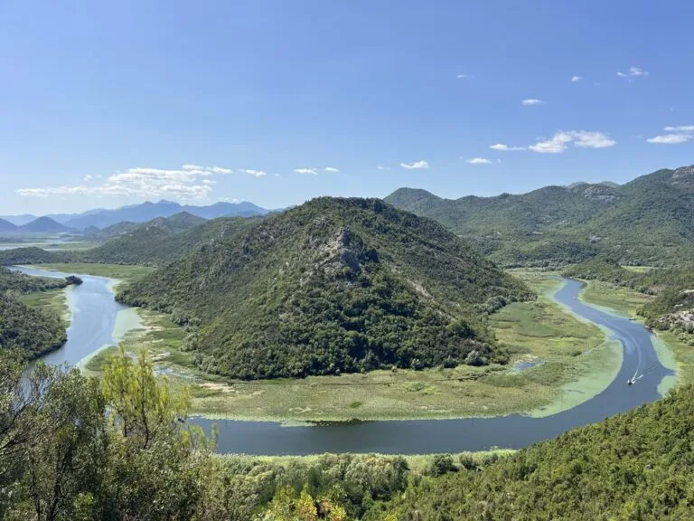 A bend in Lake Skadar around a wooded hill in Montenegro