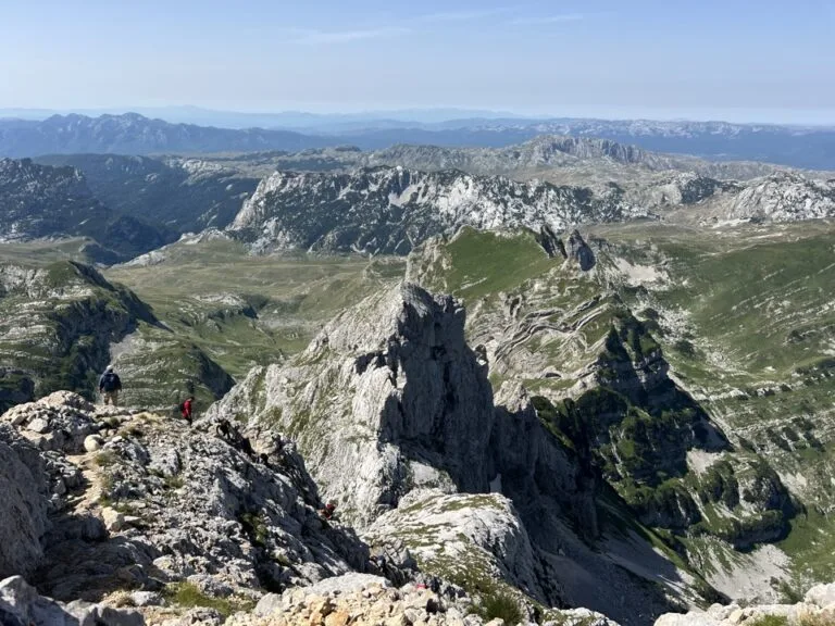 Hiker seated above the Durmitor valleys